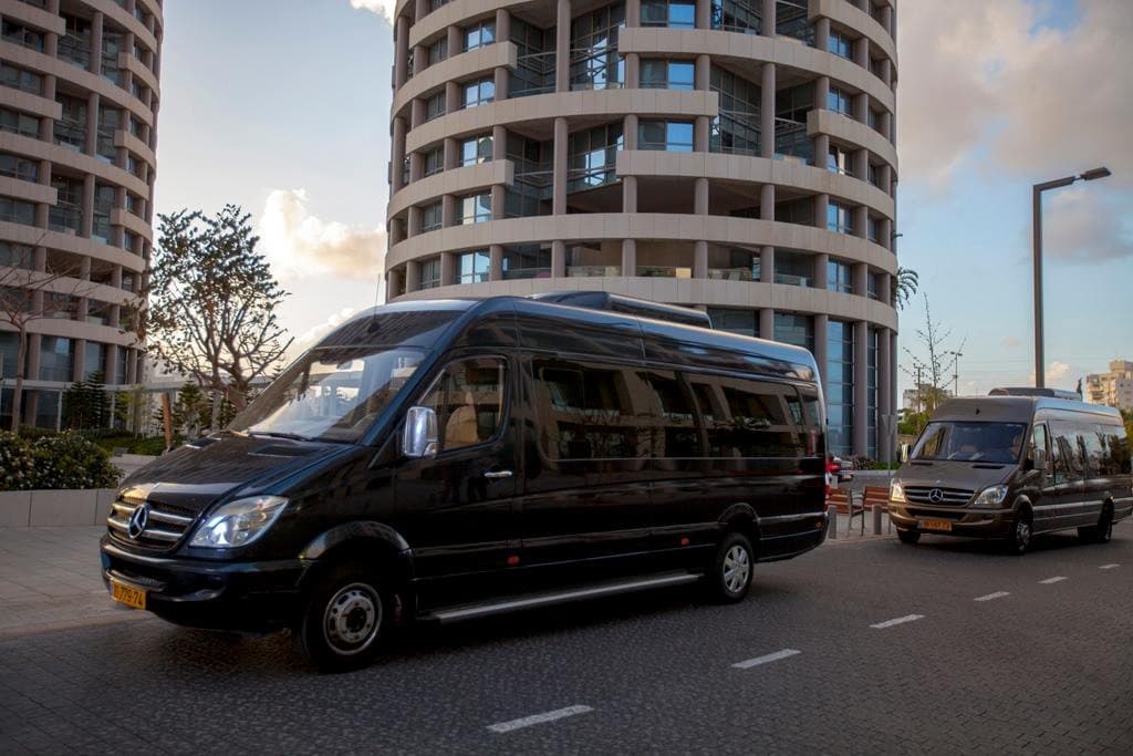 Mercedes-Benz Sprinter fleet in front of contemporary high-rise architecture